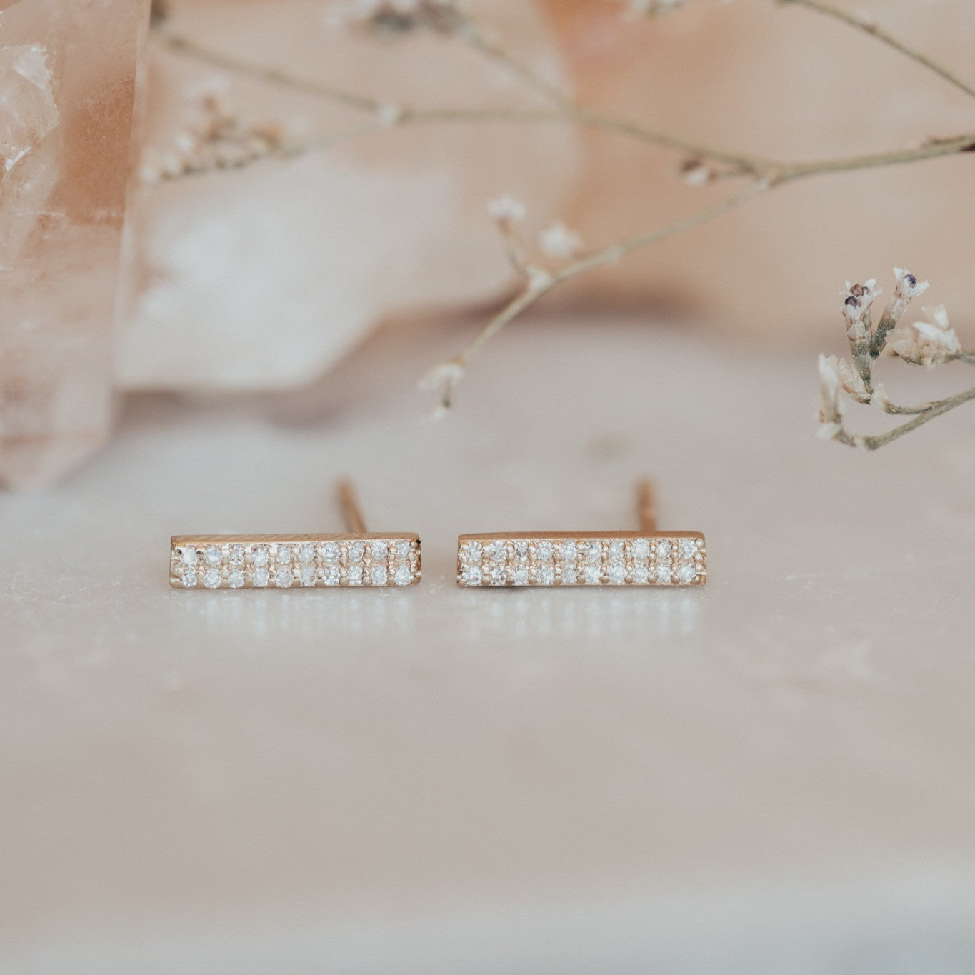 14k yellow gold double row diamond bar stud earrings, displayed on a neutral background.
