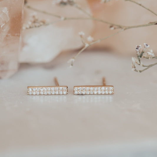 14k yellow gold double row diamond bar stud earrings, displayed on a neutral background.