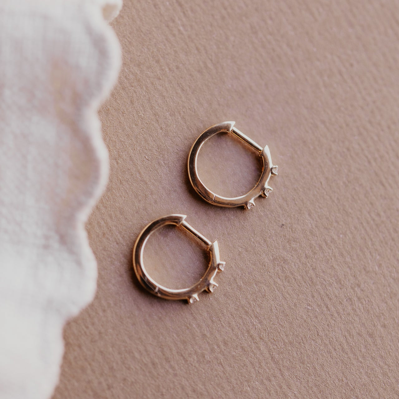 Three Prong Set Round Diamonds on Huggie Earrings