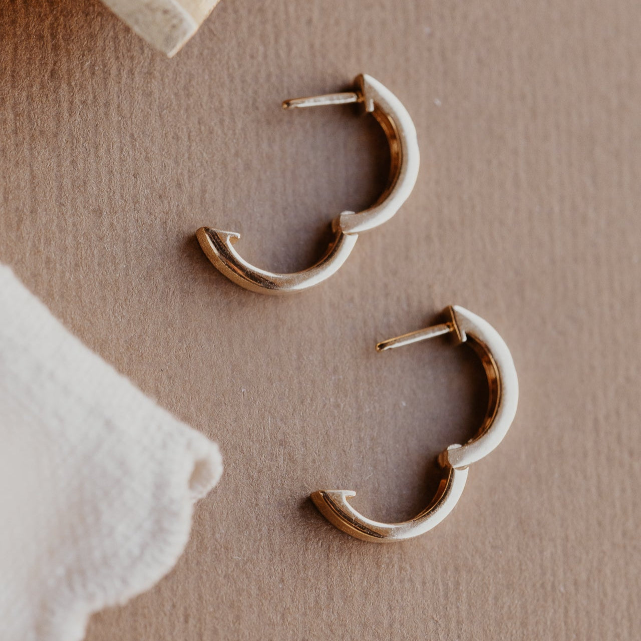 Three Hammer Set Round Diamonds on Hoop Earrings