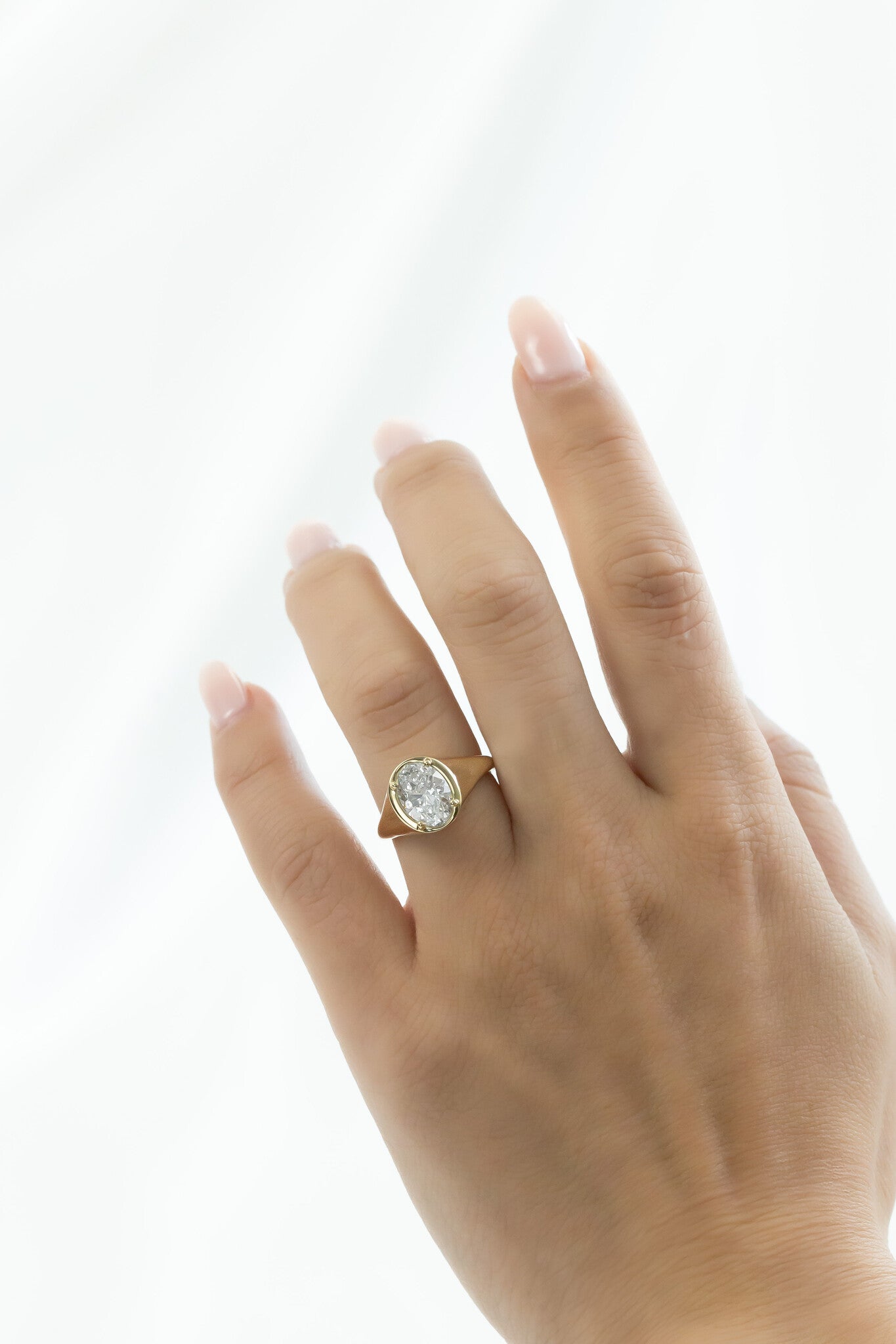 The Lennox Oval Signet Ring on a models hand