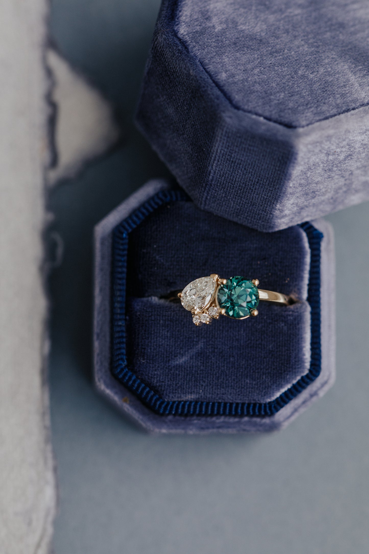 The Toi et Moi 1.70 ct Round Teal Sapphire and .50 ct Pear Diamond Ring