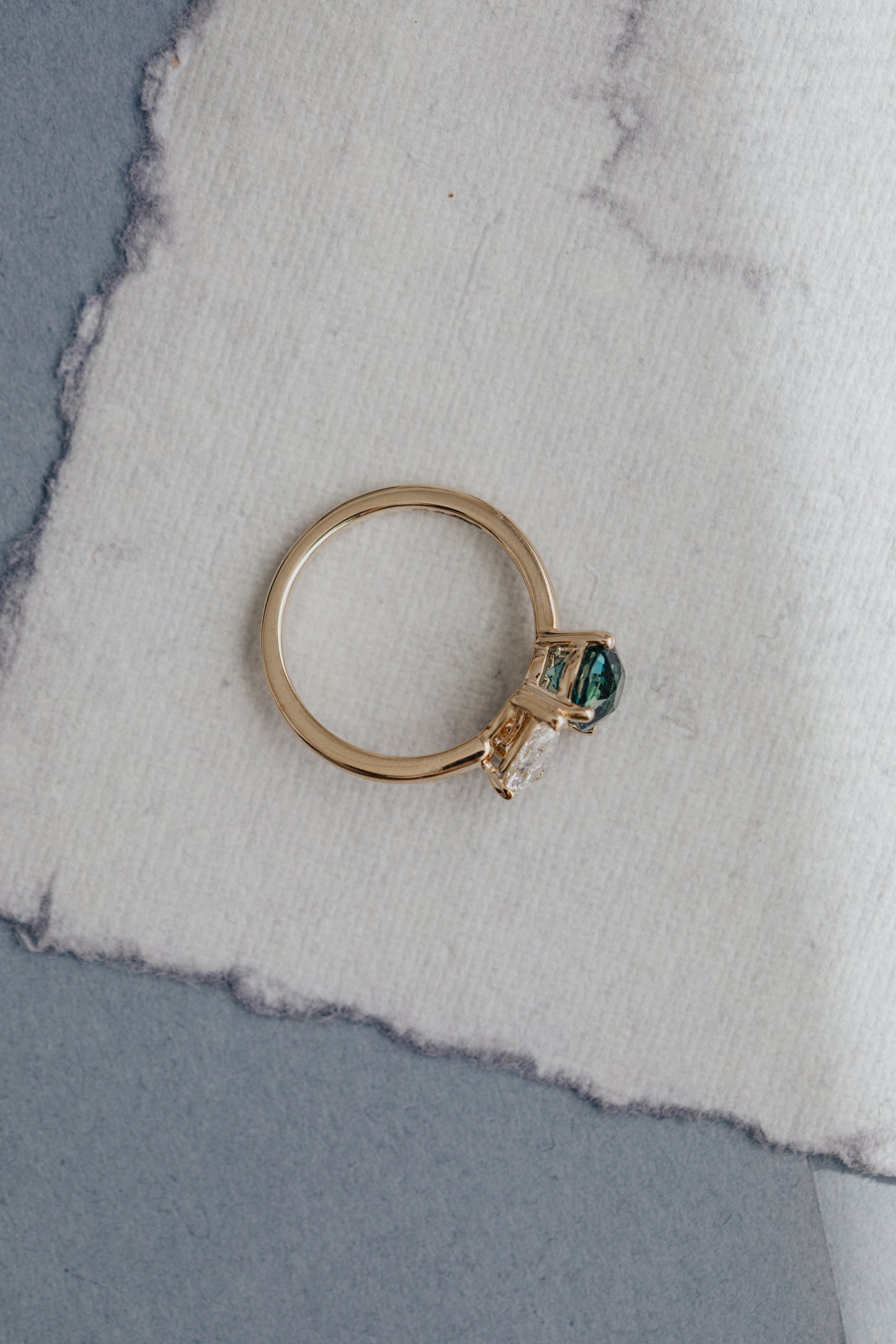 The Toi et Moi 1.70 ct Round Teal Sapphire and .50 ct Pear Diamond Ring