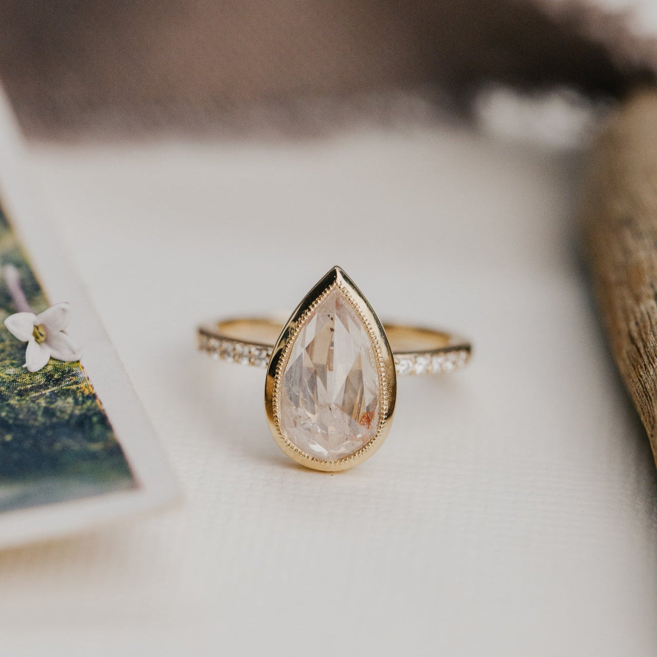 3.31 ct Pear Clear and Peach Rustic Diamond Ring in 14k yellow gold with a natural diamond band