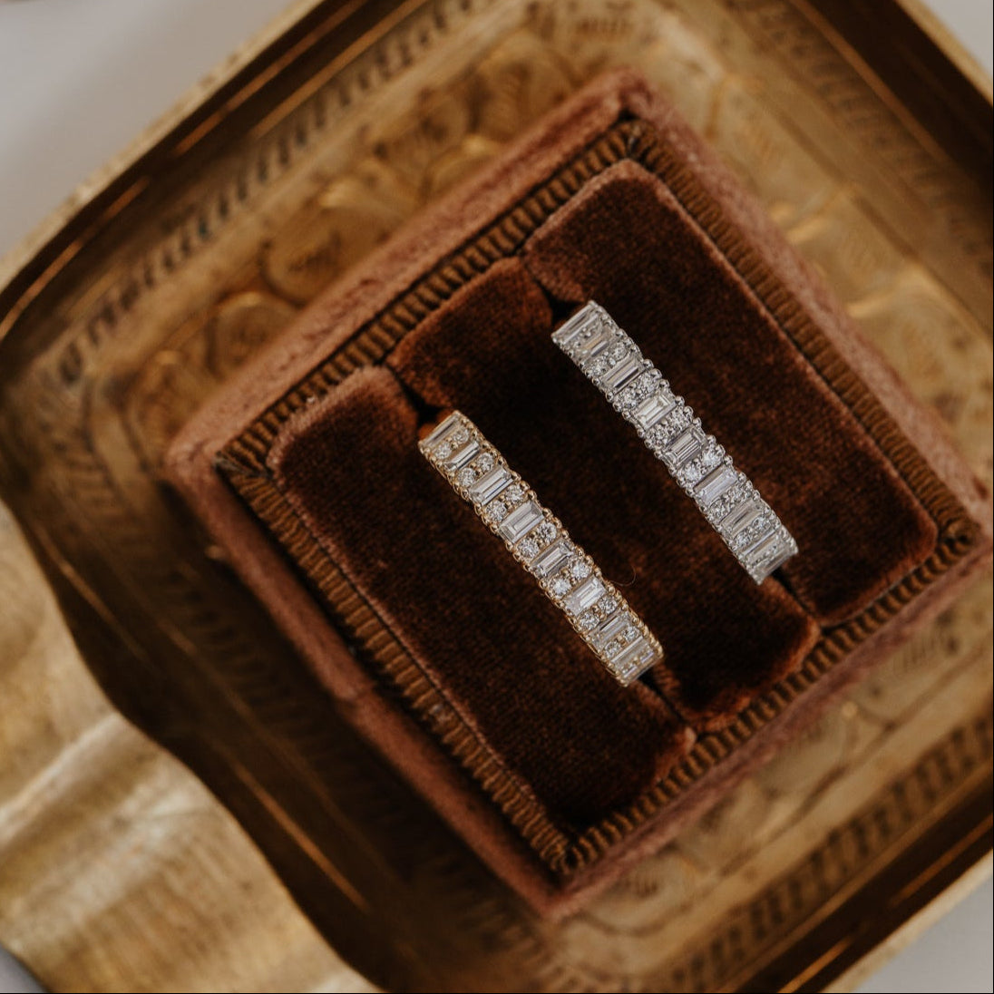 14k gold band featuring ~.49 cttw baguette and double round diamonds set in prongs in an alternating design