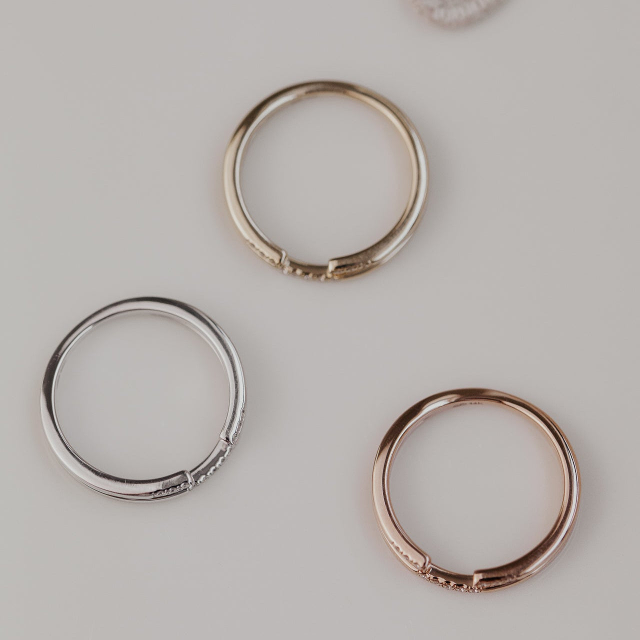 14k gold band featuring two stacked round pave bands with a total carat weight of ~.05 cttw.