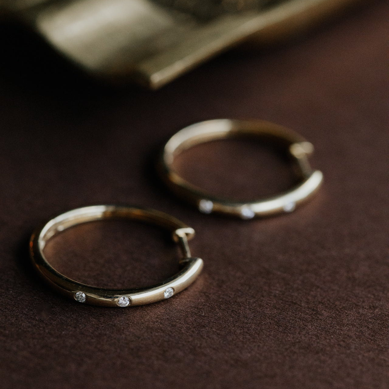 Hammer Set Diamonds on Thin Hoop Earrings