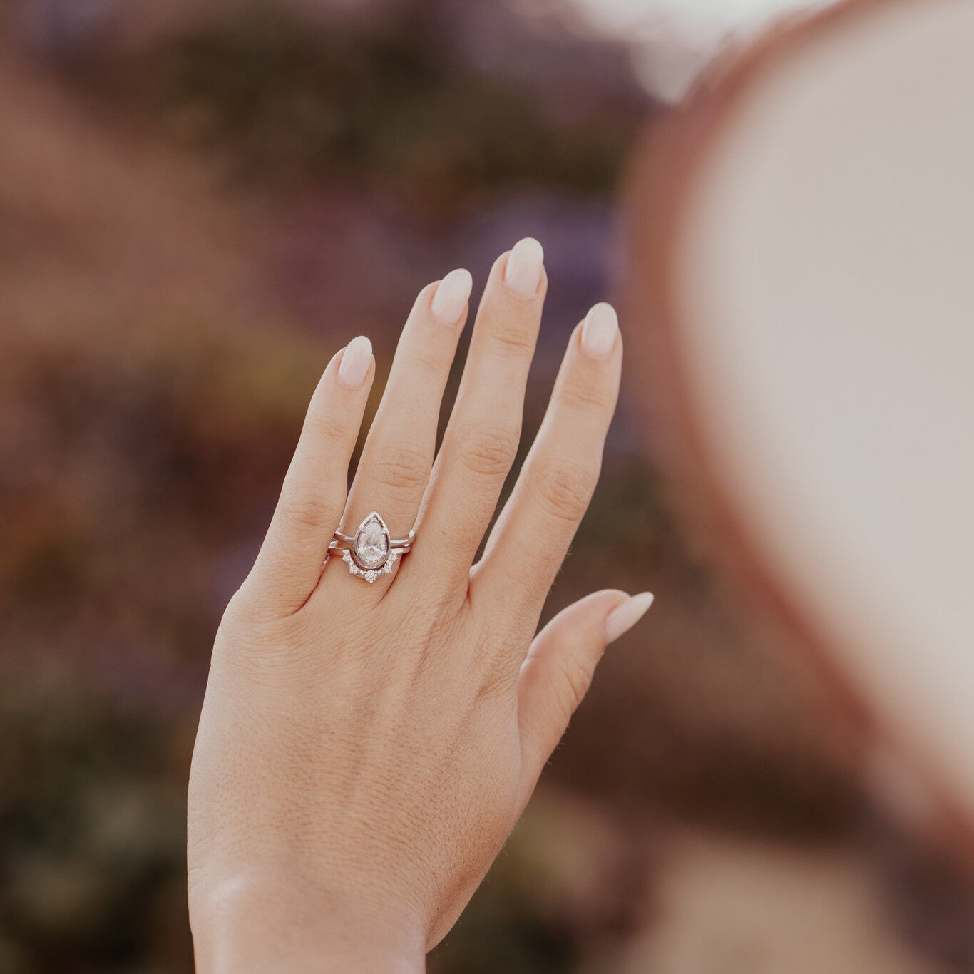 The Carmen Tracer Diamond Band. Hand model is wearing this band in 14k white gold, paired with The Carmen Pear Ring.