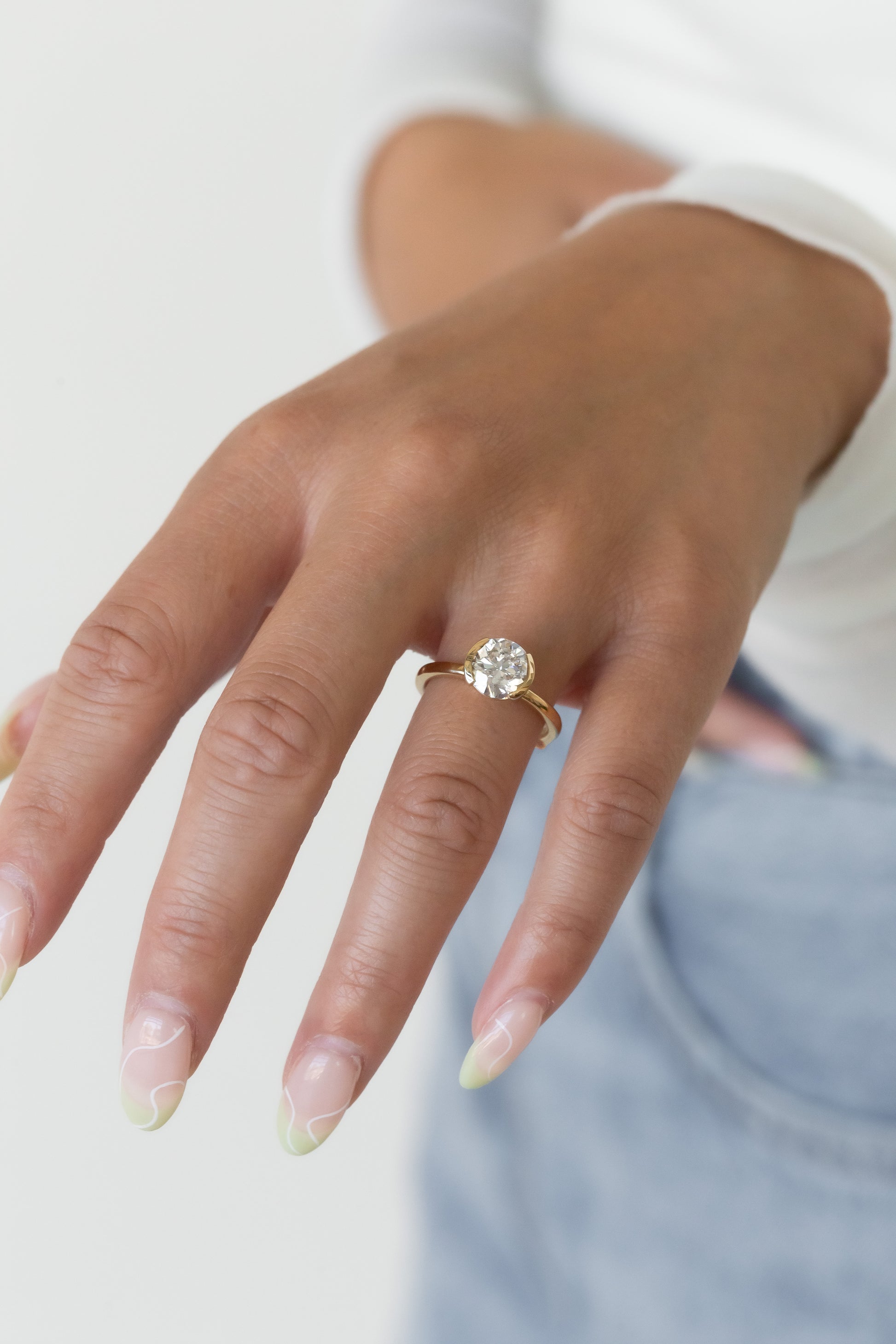 The Zadie 2.10 ct Round Lab Grown Diamond Solitaire on models hand