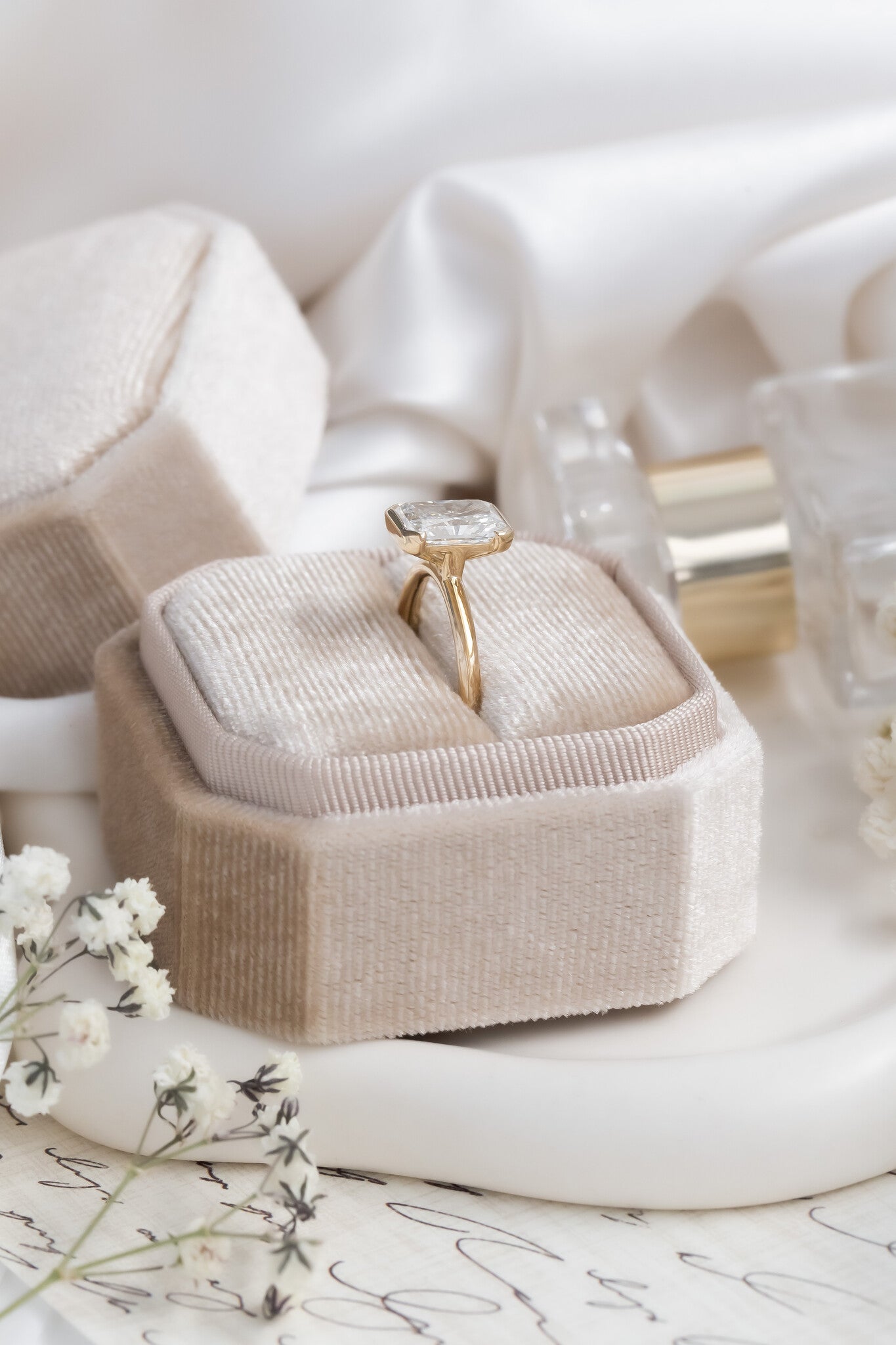 The Zadie Radiant Cut Half Bezel Solitaire Ring in 14k yellow gold