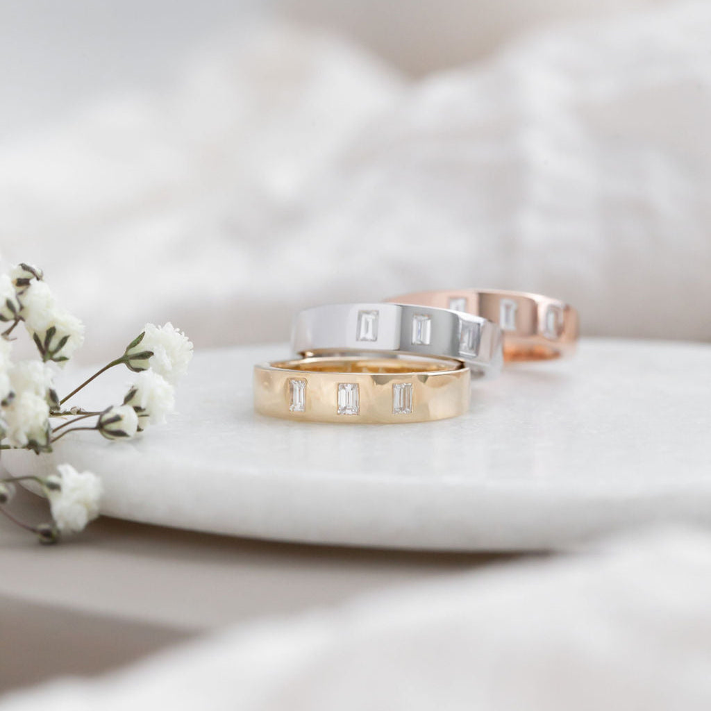 The Jaden Three Baguette Wedding Band in 14k yellow, white, and rose gold
