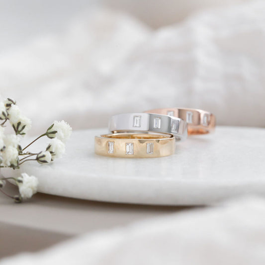 The Jaden Three Baguette Wedding Band in 14k yellow, white, and rose gold