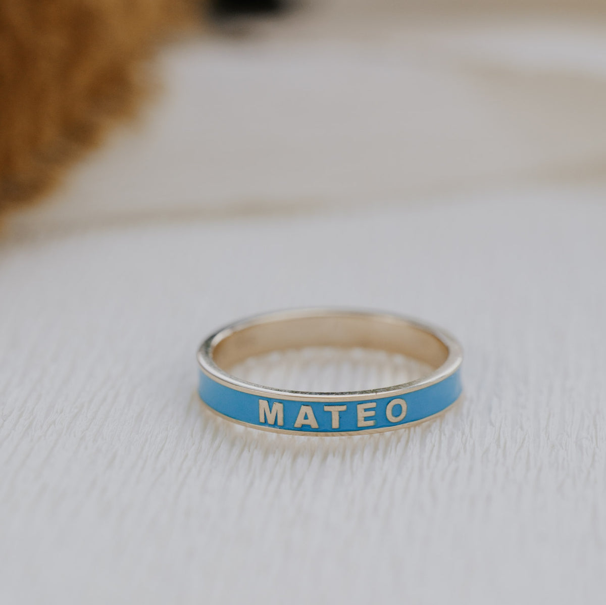 Blue customizable enamel gold band.