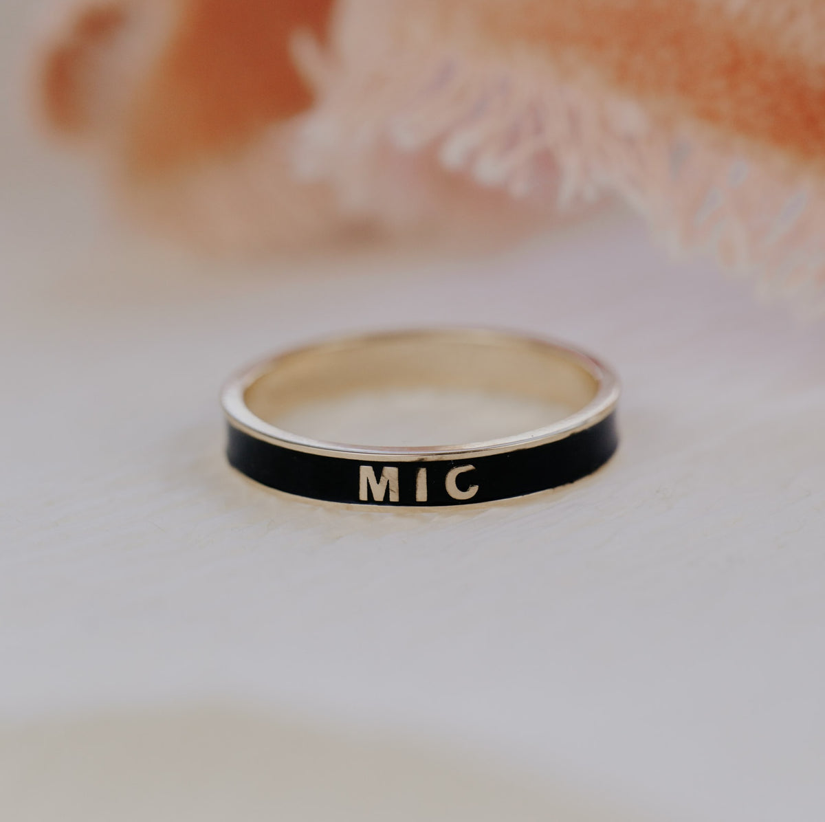 Black customizable gold enamel band.