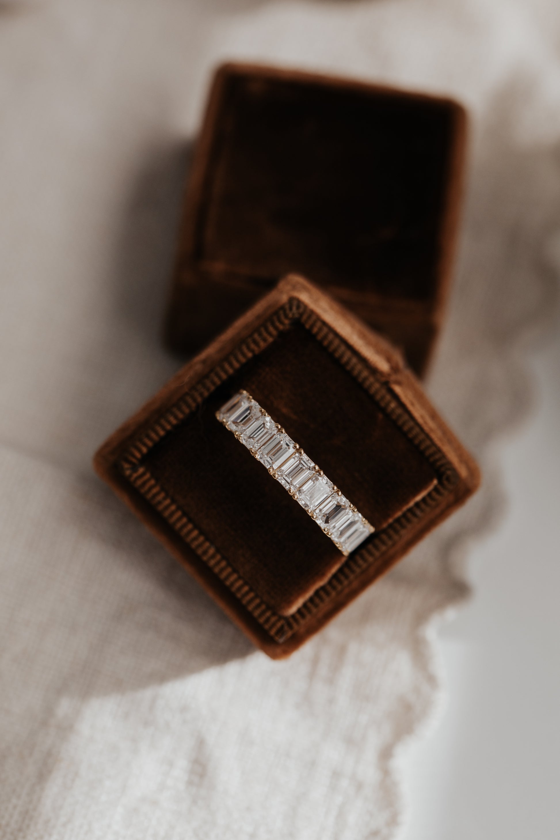 The Amara Emerald Cut Band in a Sarah O Jewelry ring box
