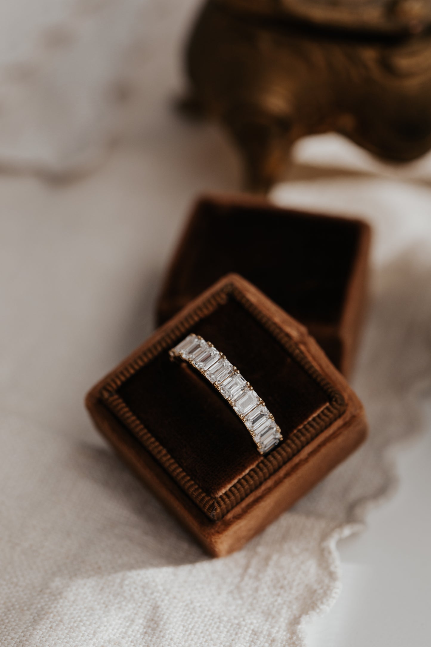 The Amara Emerald Cut Band in a Sarah O Jewelry box
