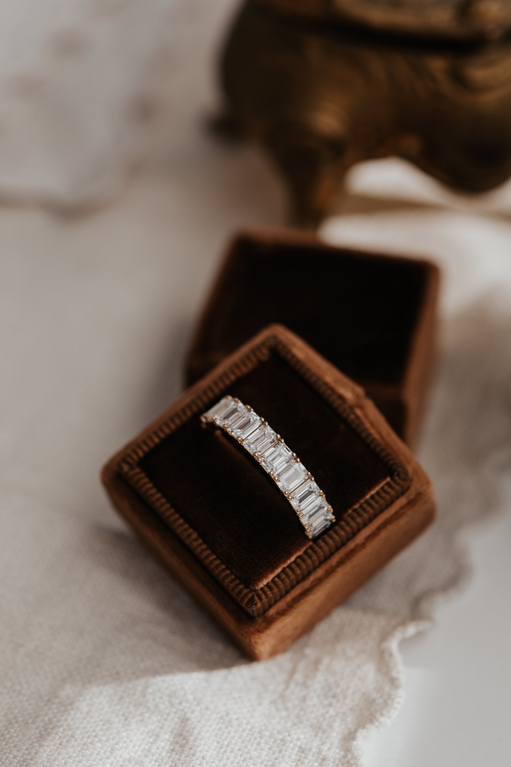 The Amara Emerald Cut Band in a Sarah O Jewelry box