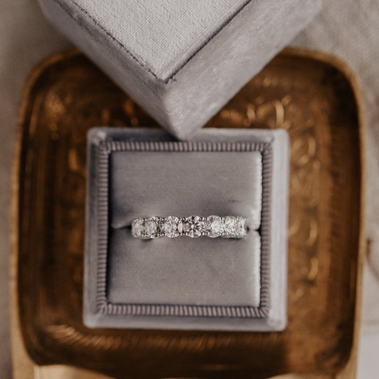 The Amara Round Eternity Diamond Band in a Sarah O Jewelry ring box