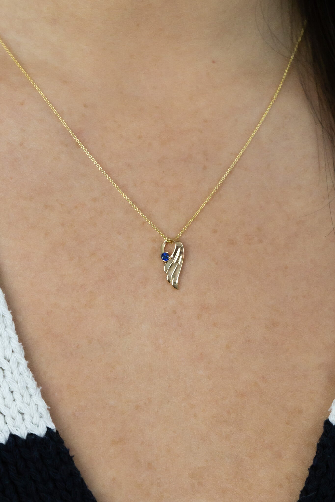 The Beloved Personalized Necklace in sapphire on models neck