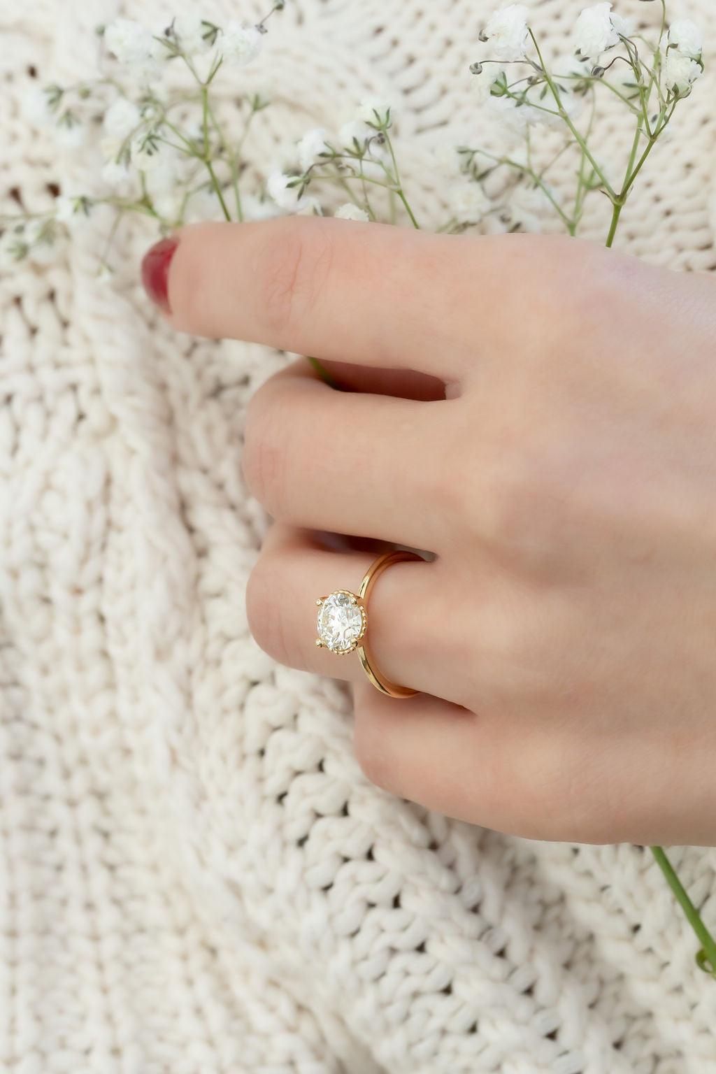The Charlotte 1.61 ct Round Natural Diamond Solitaire on models hand