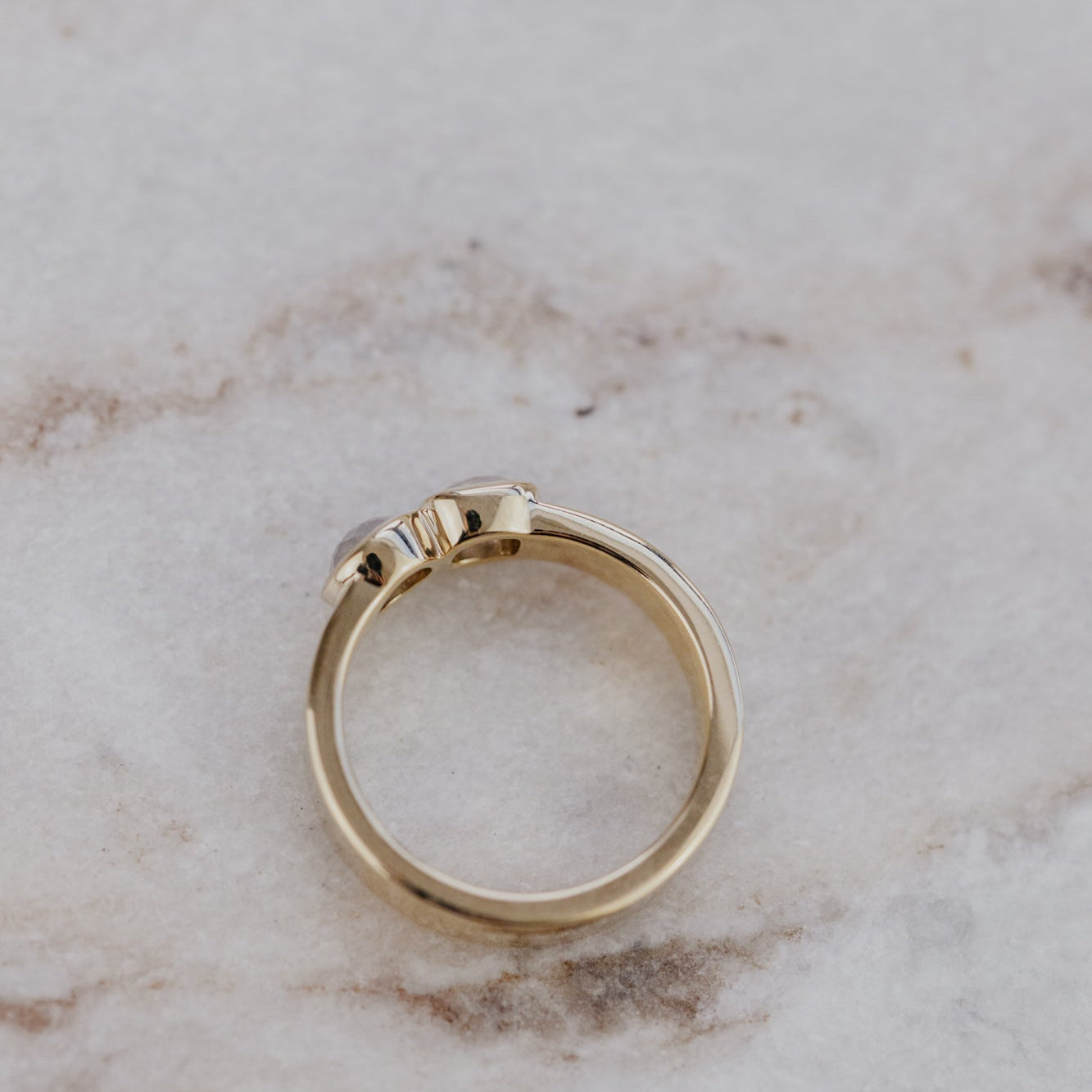 Gold ring on a marble surface