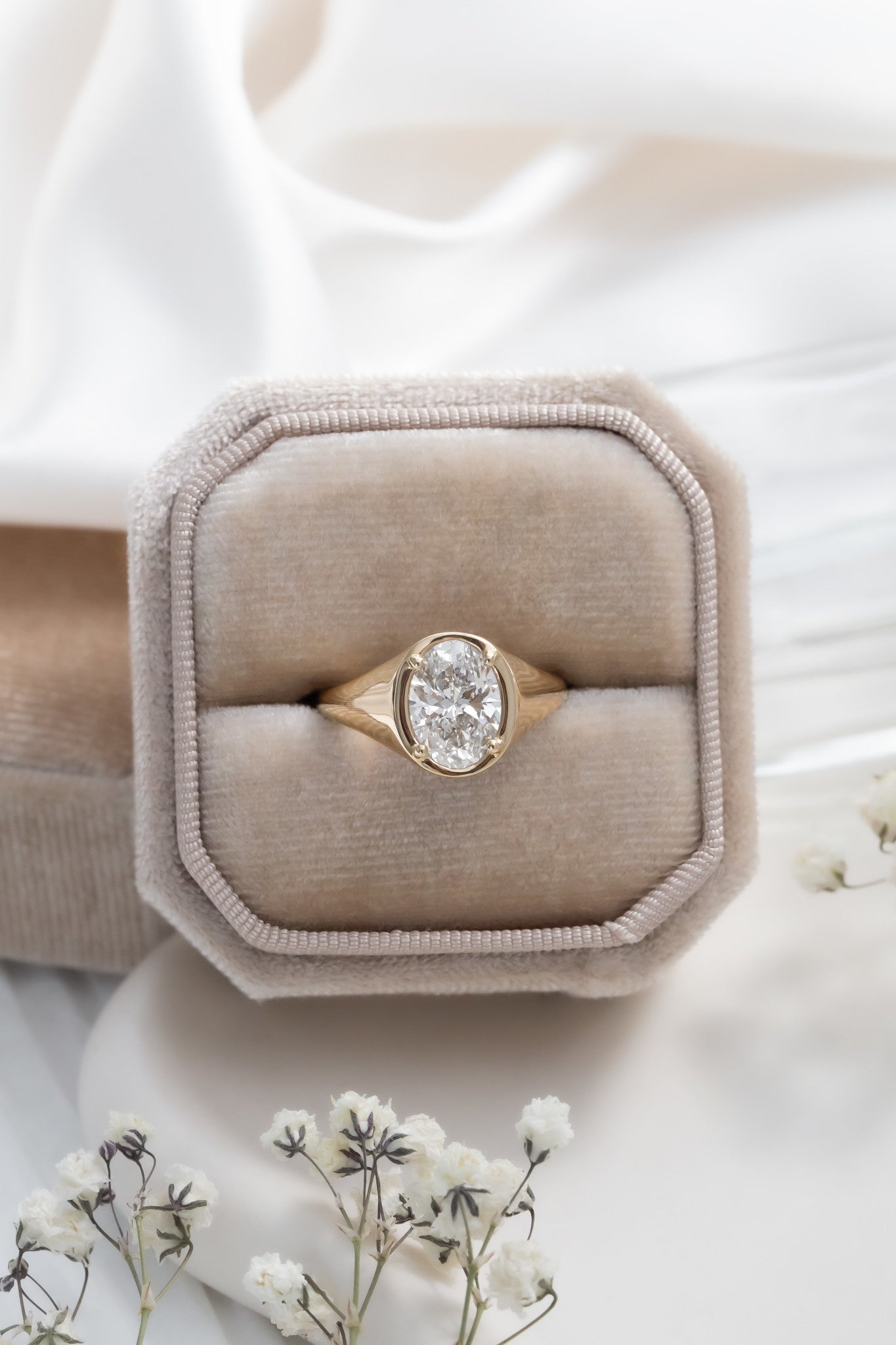 The Lennox Oval Signet Ring in a Sarah O Jewelry ring box