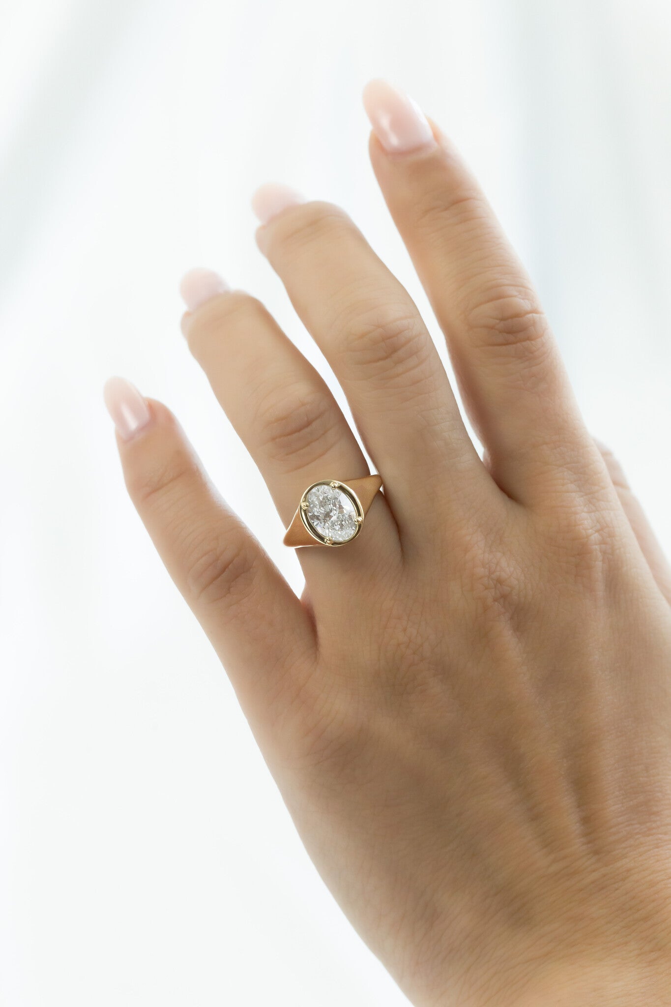 The Lennox Oval Signet Ring on a models hand