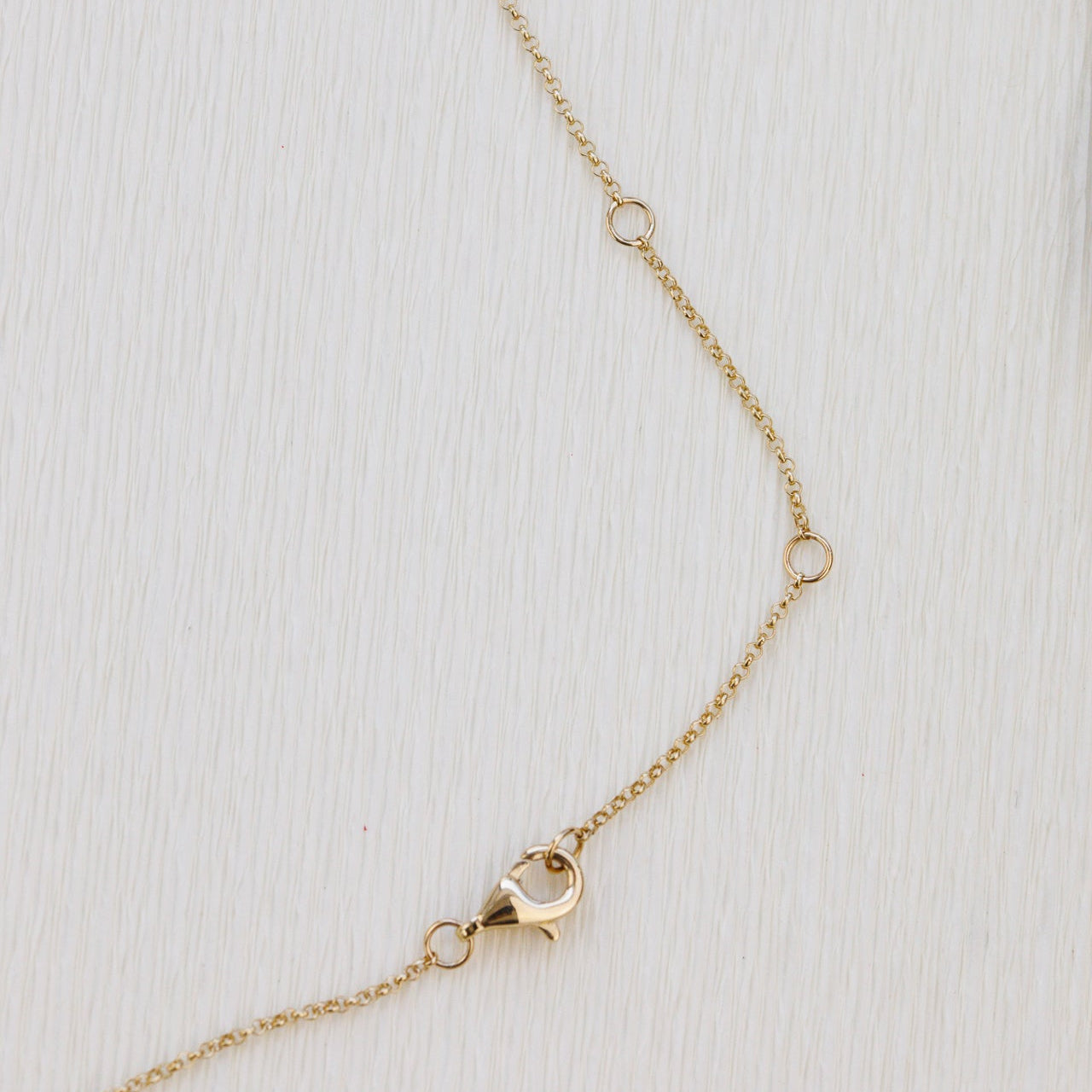 Gold necklace on a white background
