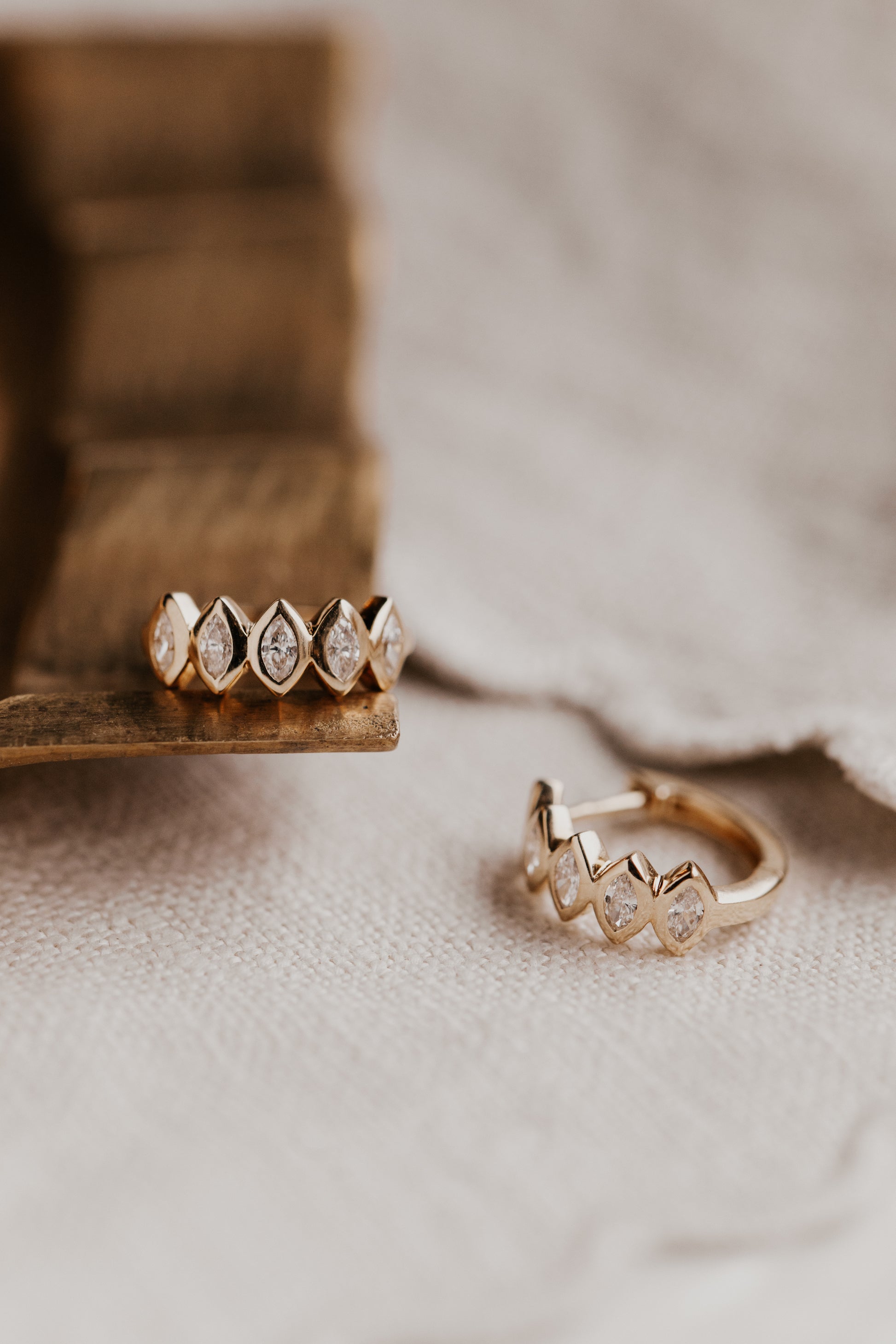  Marquise Bezel Set Diamond Huggie Earrings in 14k yellow gold