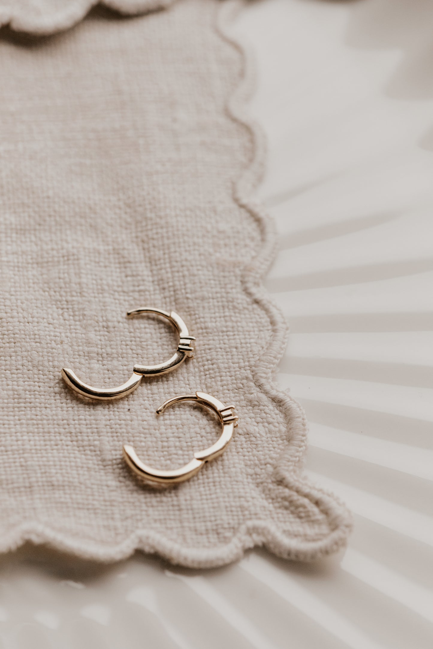 Prong Set Diamond on Huggie Earrings with a clasp closure