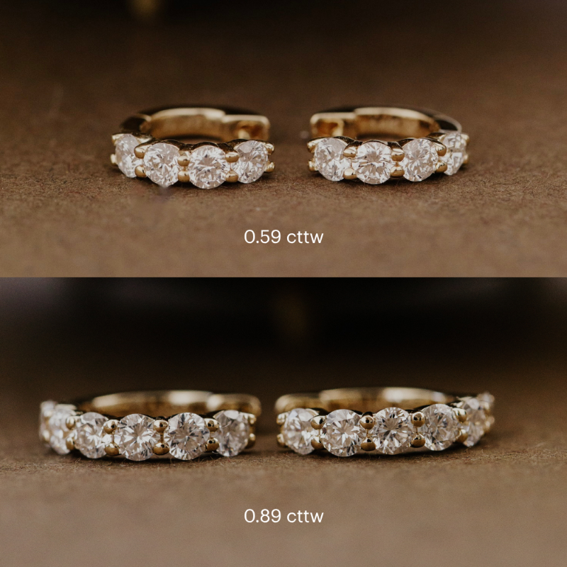 Two gold rings with diamond accents on a brown background