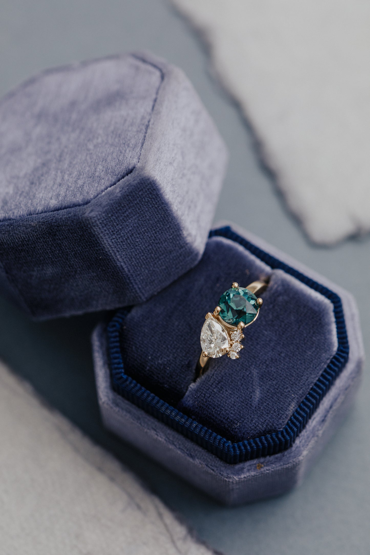 The Toi et Moi 1.70 ct Round Teal Sapphire and .50 ct Pear Diamond Ring