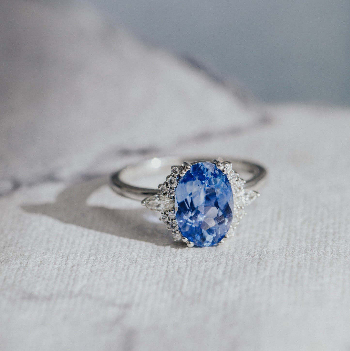 The Atlantis 2.86 ct Oval Blue Sapphire with .22 ct Side Stone Ring