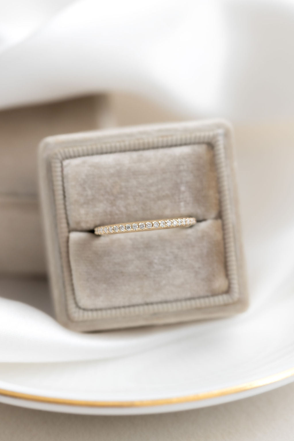 The Jenna Diamond Band in 14k yellow gold in a Sarah O Jewelry velvet ring box