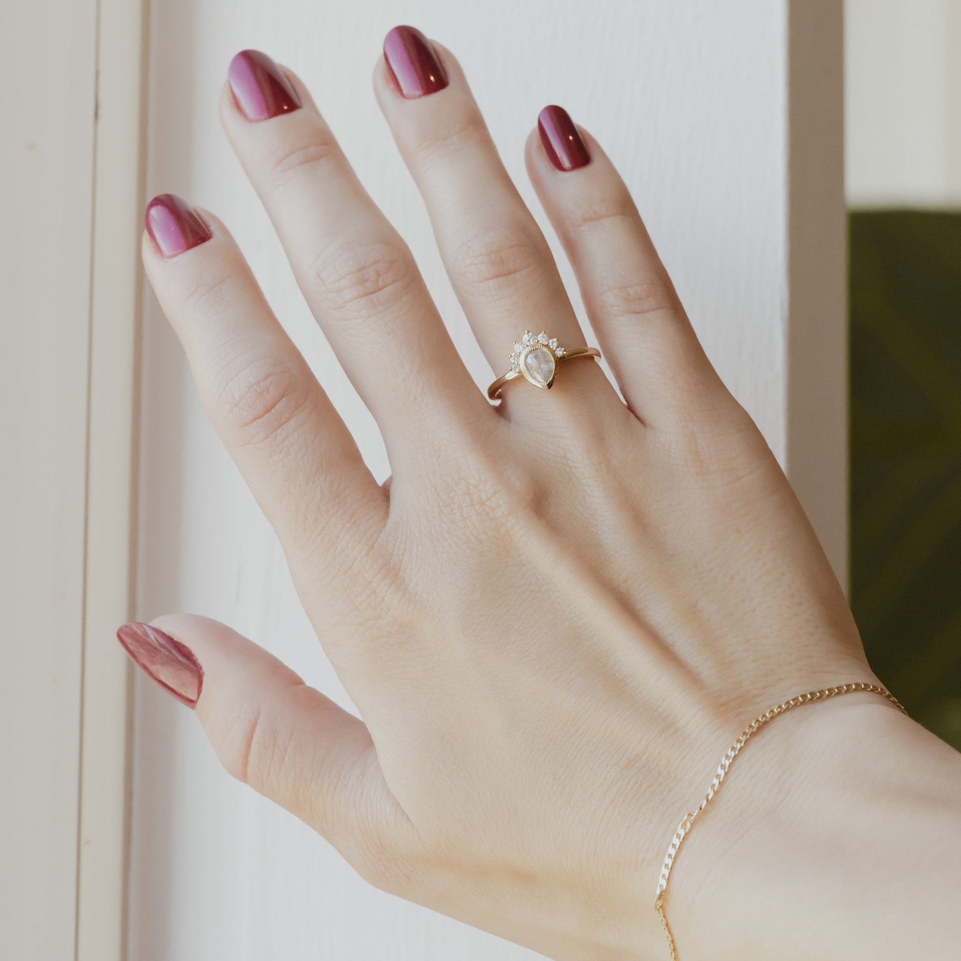 The Acadia .45 ct Pear Rustic Diamond Engagement Ring in 14k yellow gold on a models hand