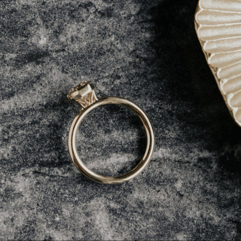 Gold ring on a textured dark surface