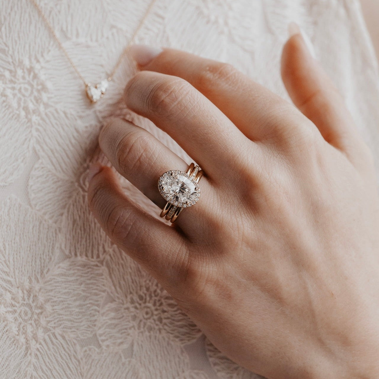 The Audrey oval diamond engagement ring with a diamond halo 