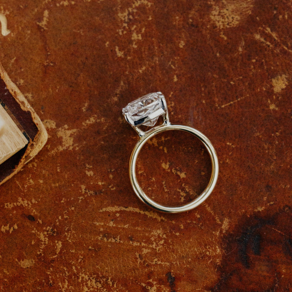 Diamond ring on a textured brown surface