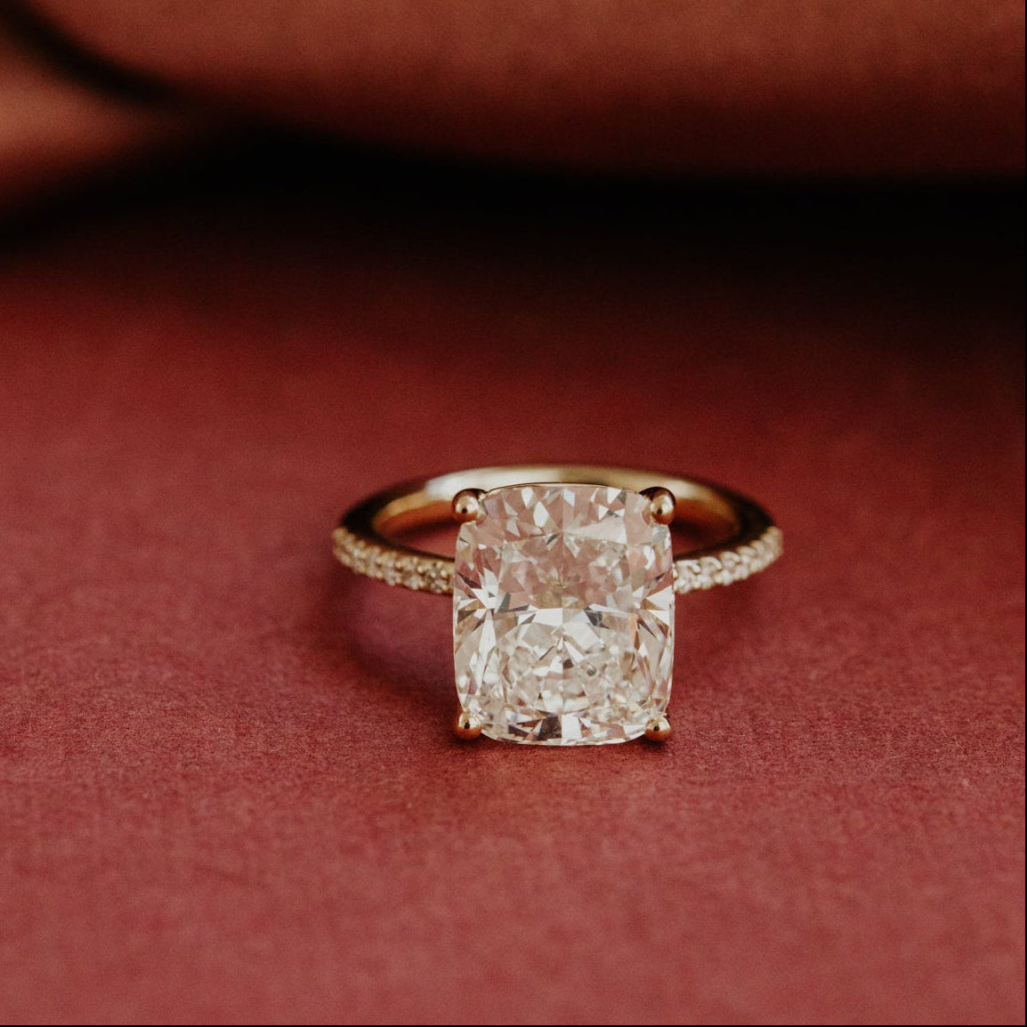 Diamond ring on a red fabric background