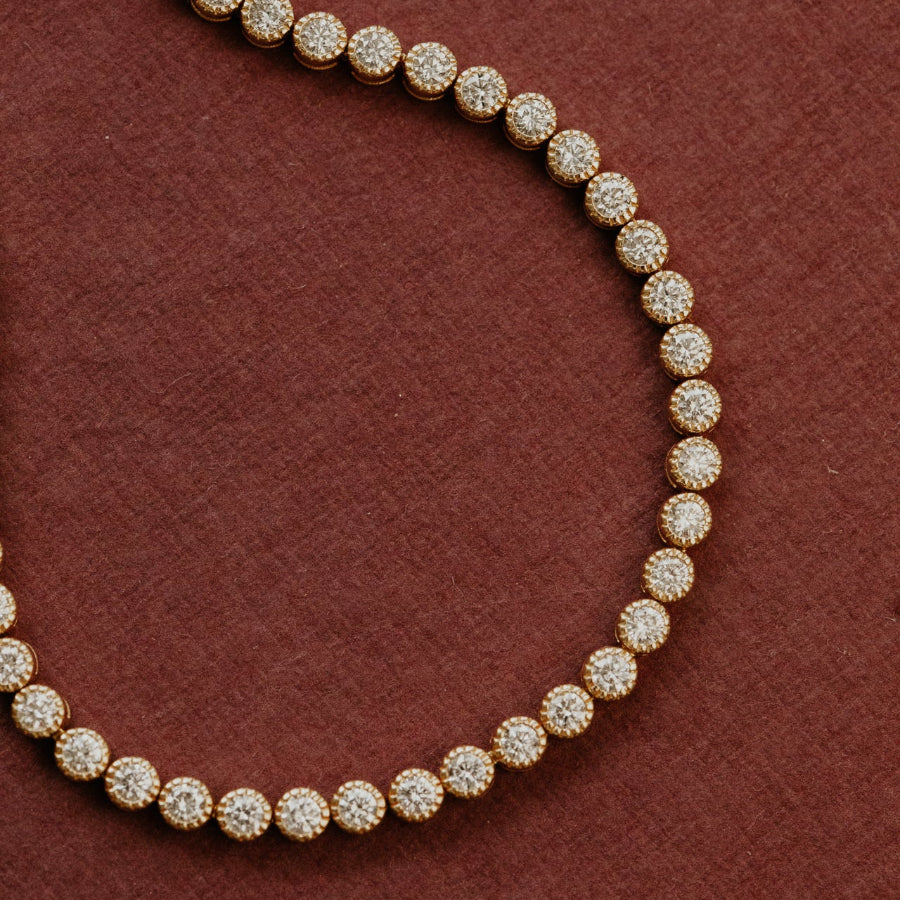 Diamond tennis bracelet on a burgundy background