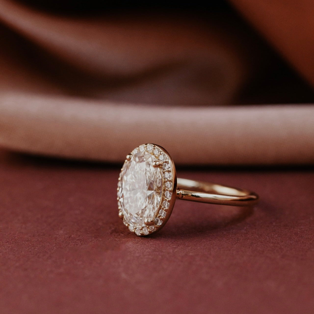 The Audrey oval diamond engagement ring with a diamond halo