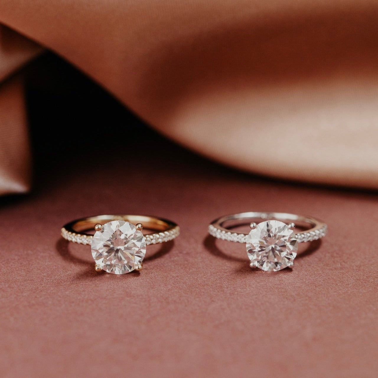 The Jenna Round Diamond Engagement Ring on a pave diamond band in 14k yellow and white gold