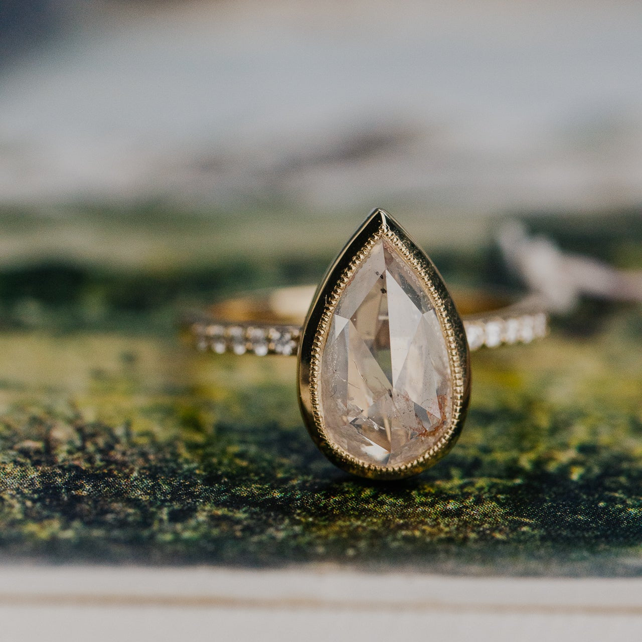 3.31 ct Pear Clear and Peach Rustic Diamond Ring in 14k yellow gold with a natural diamond band