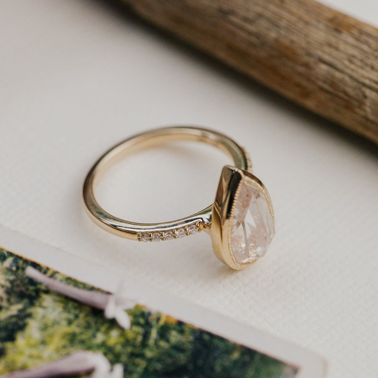 3.31 ct Pear Clear and Peach Rustic Diamond Ring in 14k yellow gold with a natural diamond band