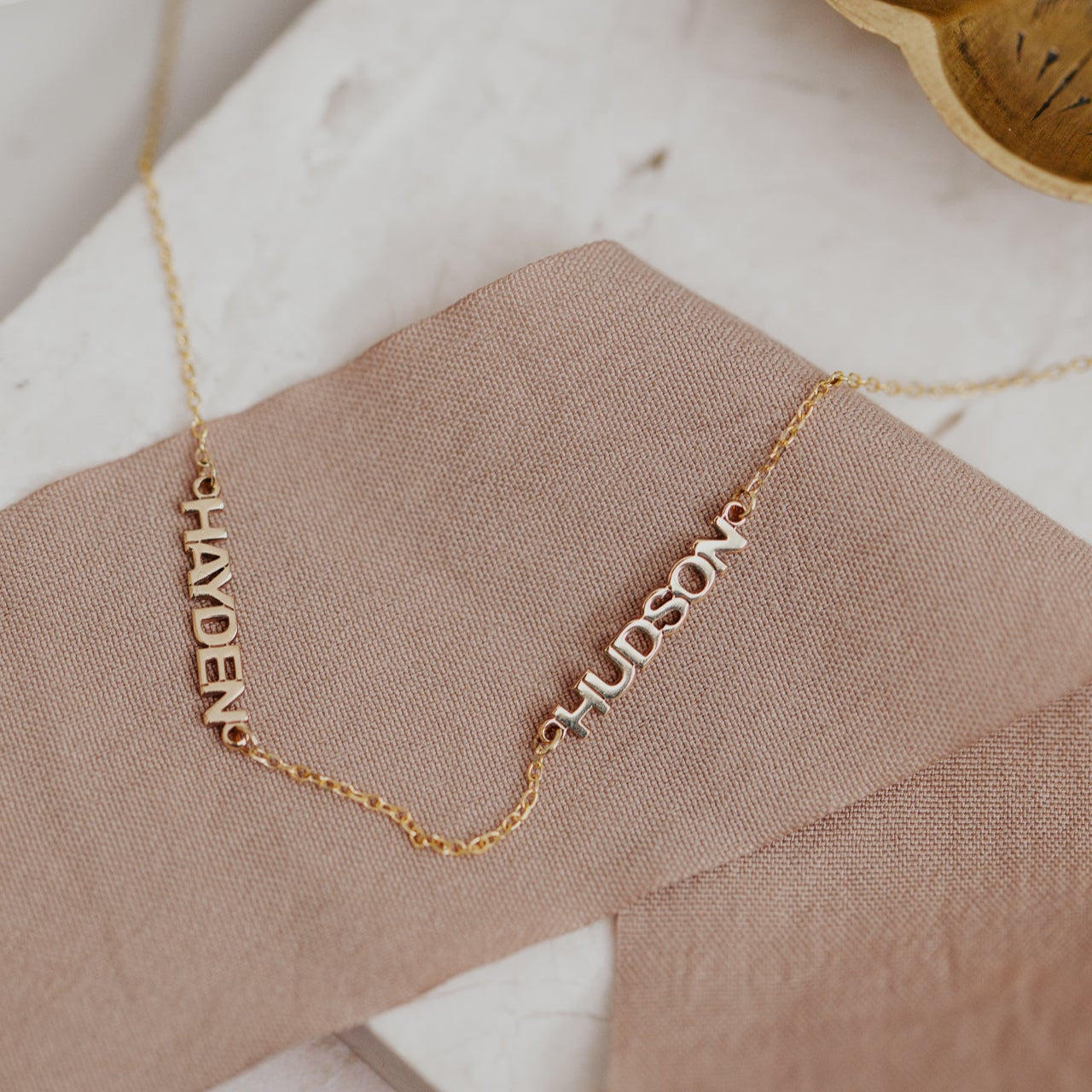 Personalized necklace with 2 custom names set on a 14k gold chain
