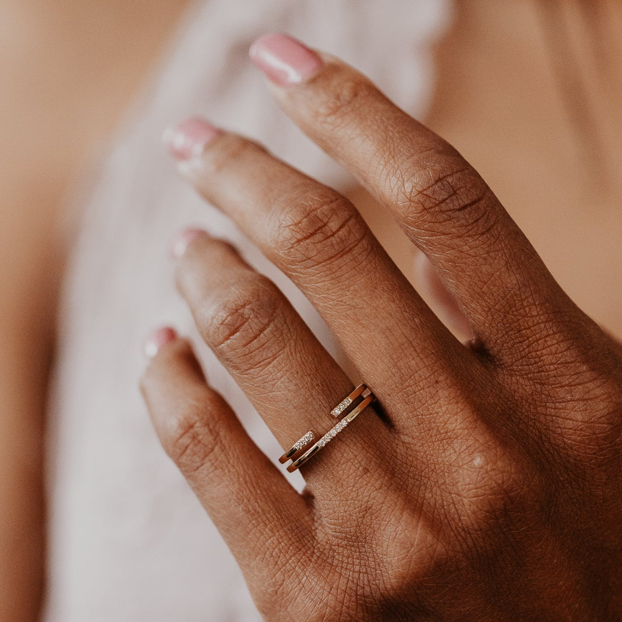 14k gold band featuring two stacked round pave bands with a total carat weight of ~.05 cttw.