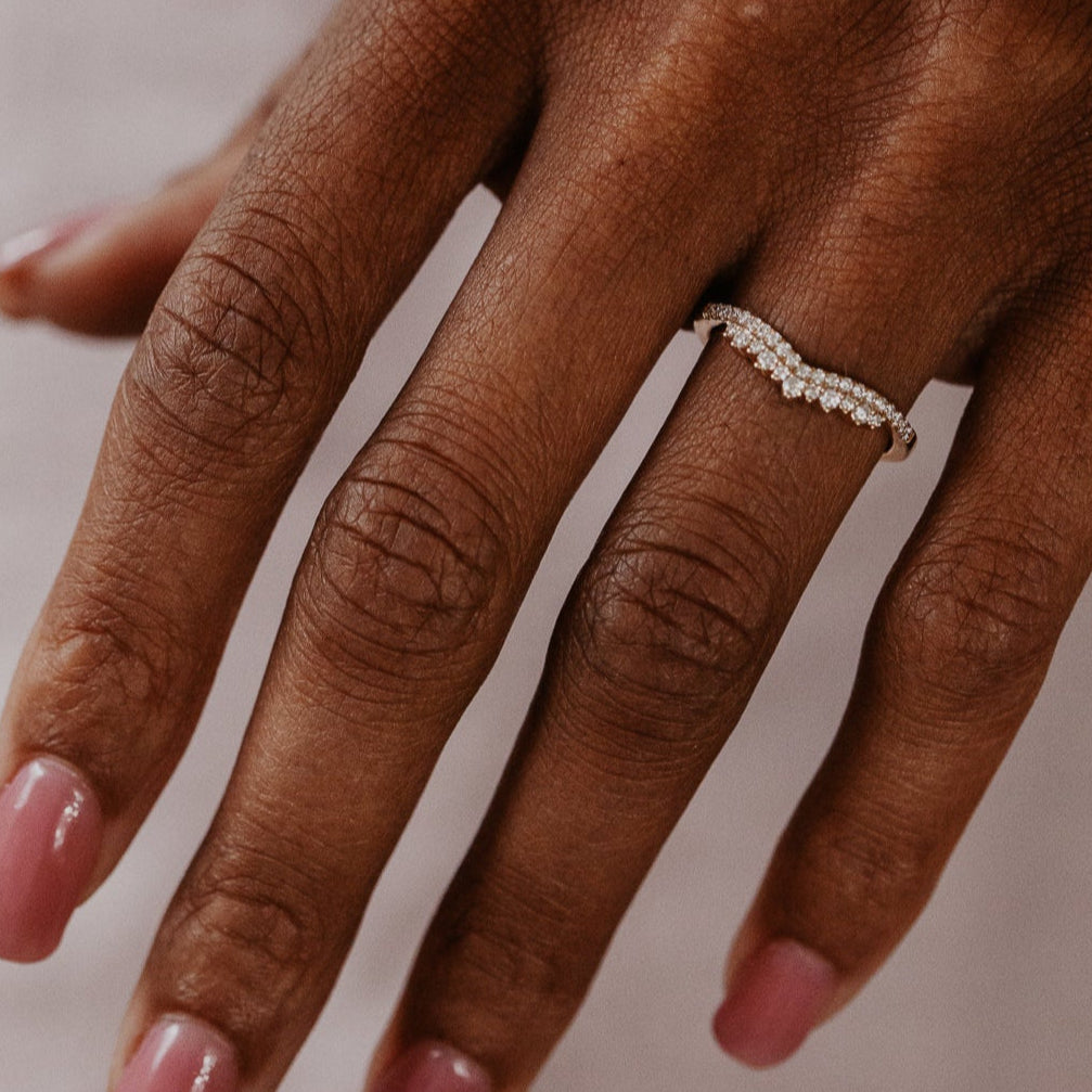 14k gold starburst tracer band featuring ~.24 cttw round pave diamonds set in a v tracer design