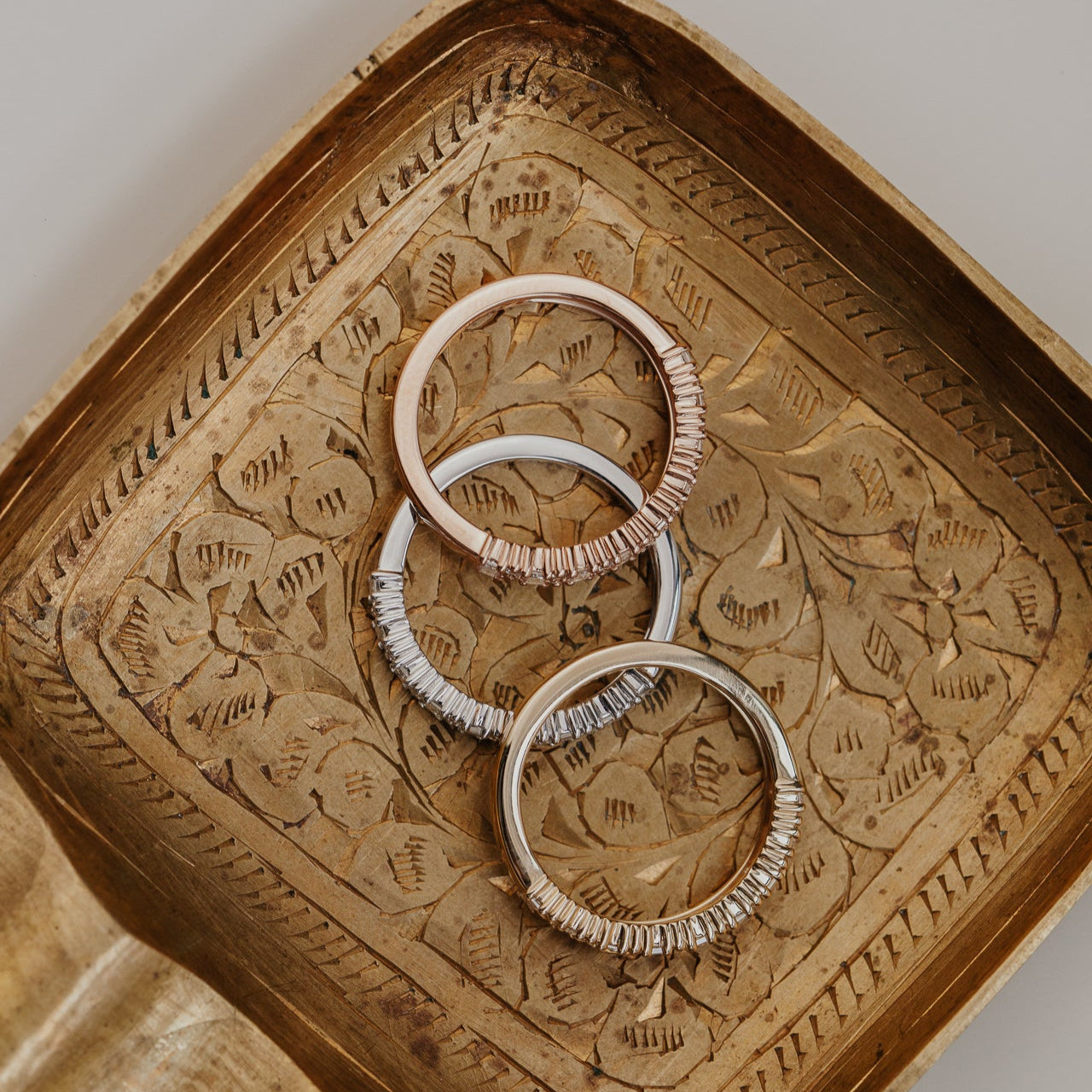 14k gold band featuring ~.49 cttw baguette and double round diamonds set in prongs in an alternating design 