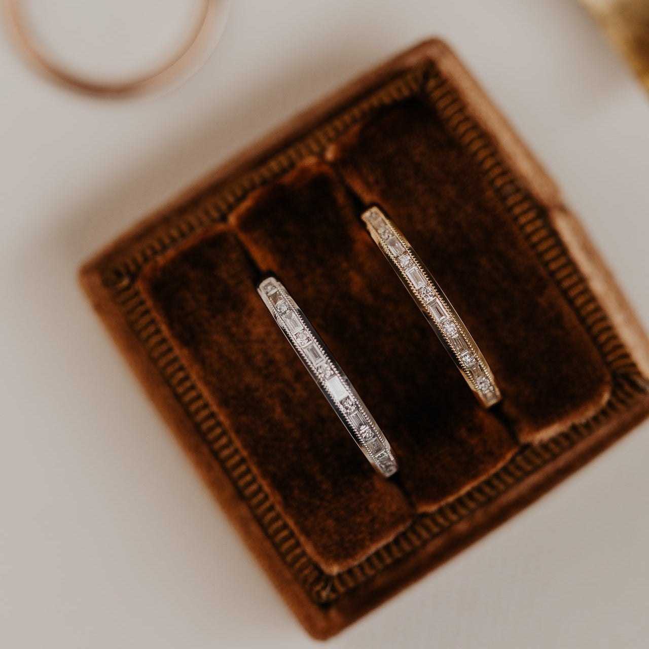 14k gold band featuring ~ .22 cttw baguette and round diamonds set in milgrain detail edges.