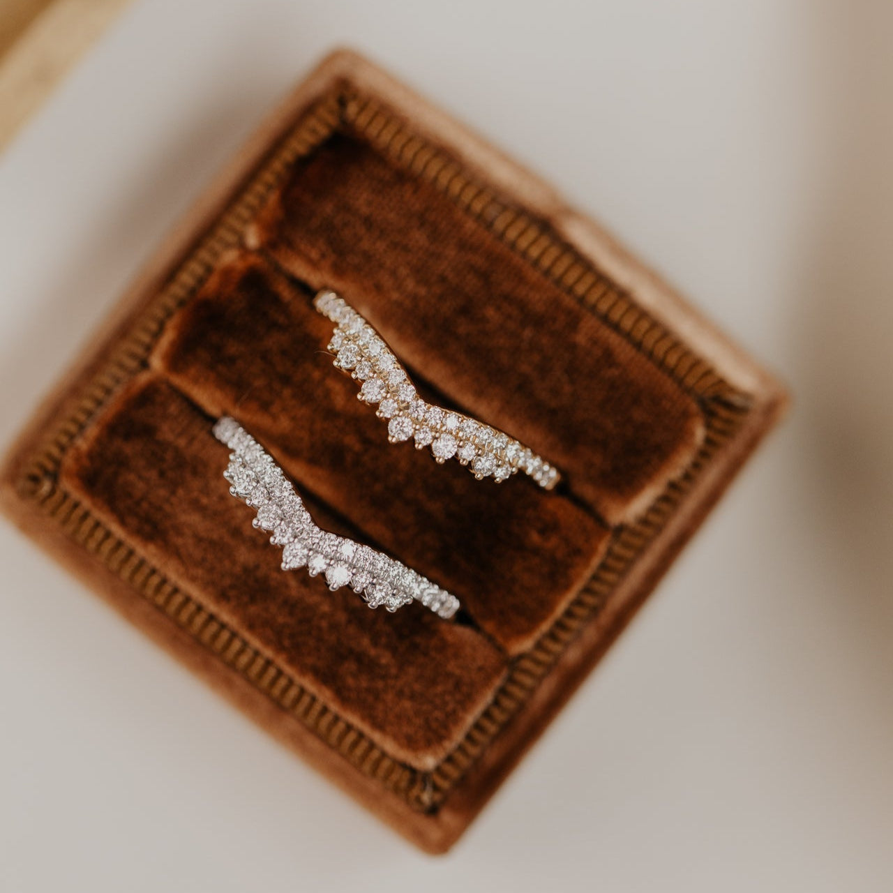 14k gold starburst tracer band featuring ~.24 cttw round pave diamonds set in a v tracer design